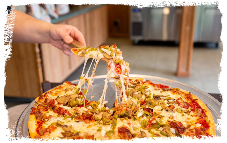 DiCarlo's pizza slice lifted with cheese pull